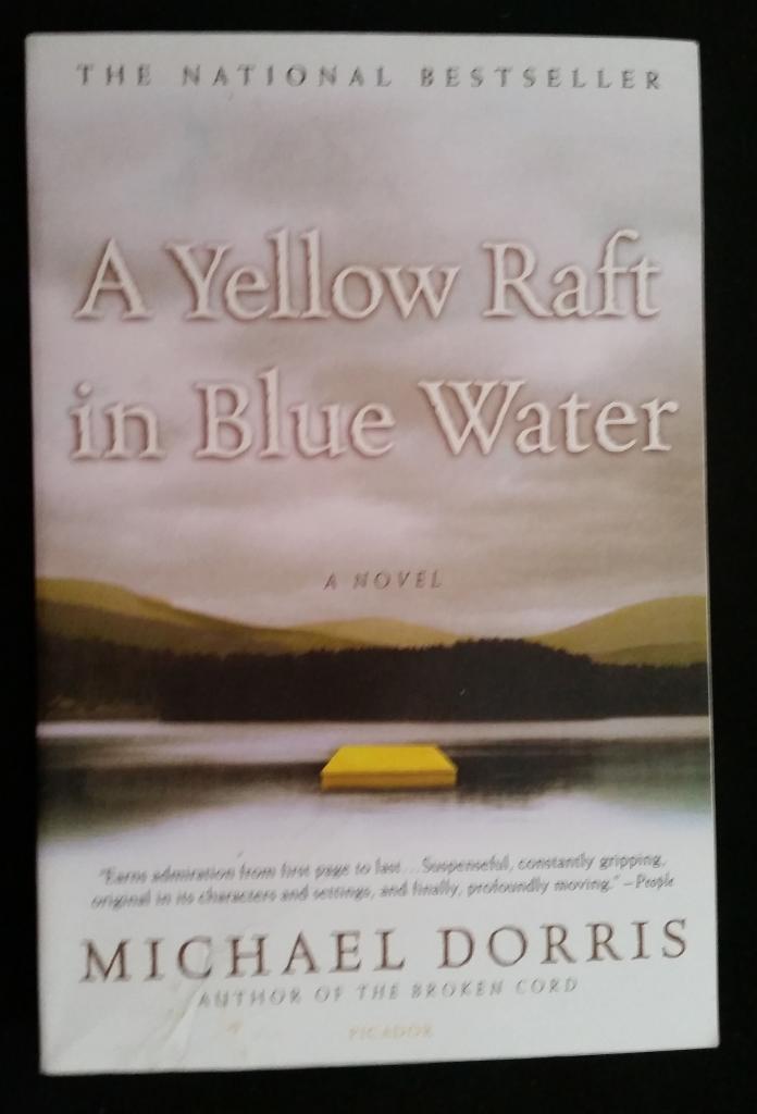A yellow raft in blue water