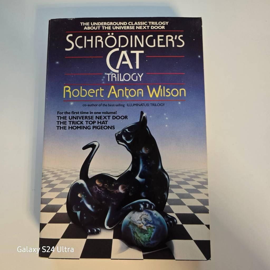 Schrodinger's Cat Trilogy: The Universe Next Door, the Trick Top Hat, & the Homing Pigeons