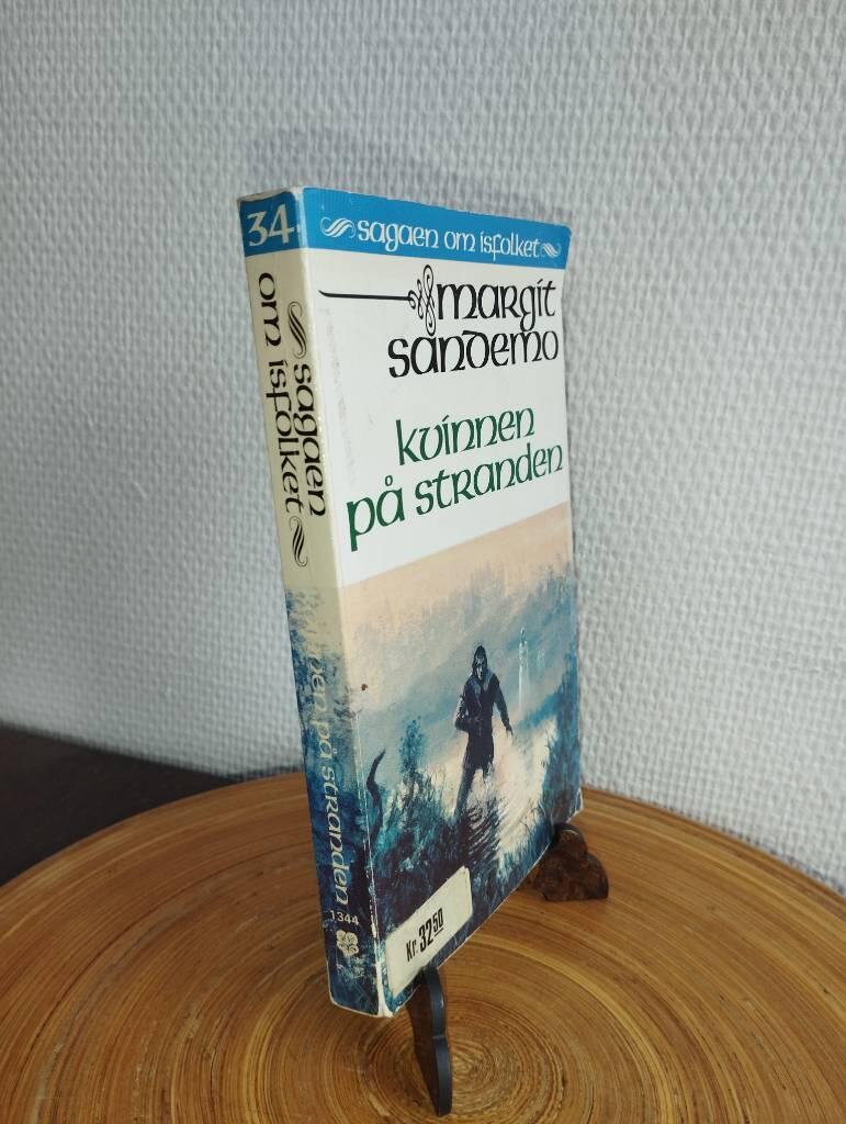 Kvinnen p&aring; stranden