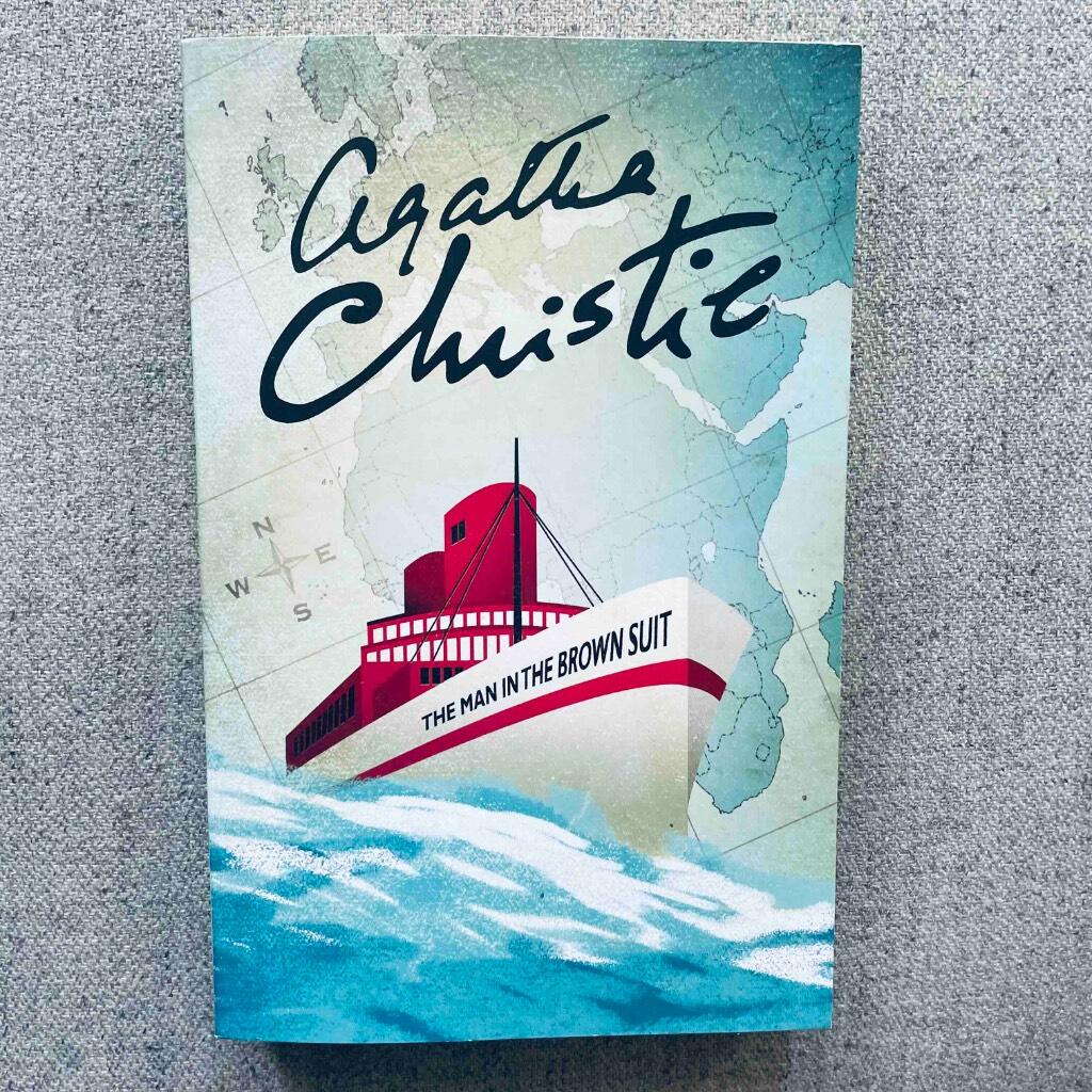 The man in the brown suit