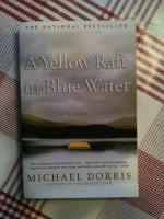 A yellow raft in blue water