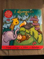 I djungeln : en bok med luckor och annat kul!