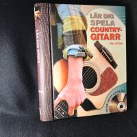 L&auml;r dig spela countrygitarr. Med CD.