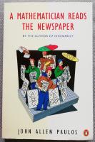 A mathematician reads the newspaper