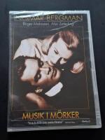 Musik i m&ouml;rker (Inplastad)