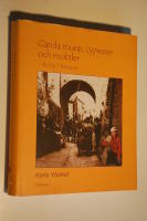 Gamla murar, cypresser och mobiler : en by i Toscana