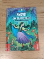 Sn&ouml;vit och de sju trollen