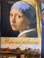Flicka med p&auml;rl&ouml;rh&auml;nge