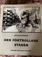 Den f&ouml;rtrollade staden : en bok om Palle Nielsen