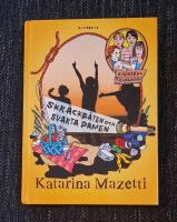 Skr&auml;ckb&aring;ten och svarta damen