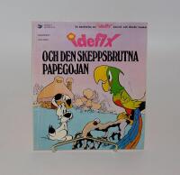 Idefix och den skeppsbrutna papegojan : en ber&auml;ttelse om Idefix, Asterix' och Obelix' lille kompis