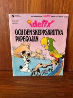 Idefix och den skeppsbrutna papegojan : en ber&auml;ttelse om Idefix, Asterix' och Obelix' lille kompis