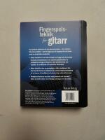 Fingerspelsteknik f&ouml;r gitarr : [Hur man spelar folkmusik, jazz, country, rock, blues, latinamerikansk]