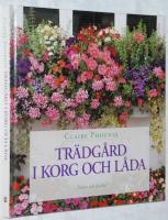 Tr&auml;dg&aring;rd i korg och l&aring;da