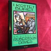 I k&ouml;ttet buret : [en roman]