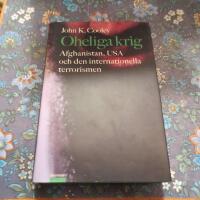 Oheliga krig :Afghanistan, USA och den internationella terrorismen